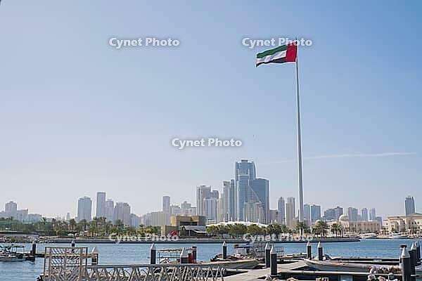 SHARJAH, UAE February 14, 2023: Flag of the United Arab Emirates in Sharjah on the coast [IBR125411124]