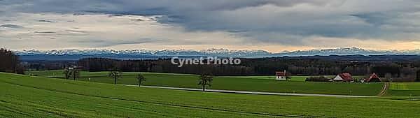 Panoramic view of the green, Upper Swabian foothills of the Alps in [IBR125411160]