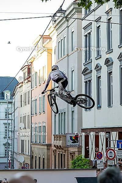05 September 2026, a mountain biker leaps through the air during the Red Bull Stuttgart Cerro Abajo urban downhill race in Stuttgart, Germany [IBR113394889]