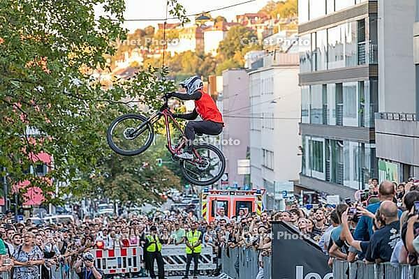 05 September 2026, A rider jumps mid-air during the Red Bull Cerro Abajo urban downhill mountain bike race in Stuttgart, Germany [IBR113394895]