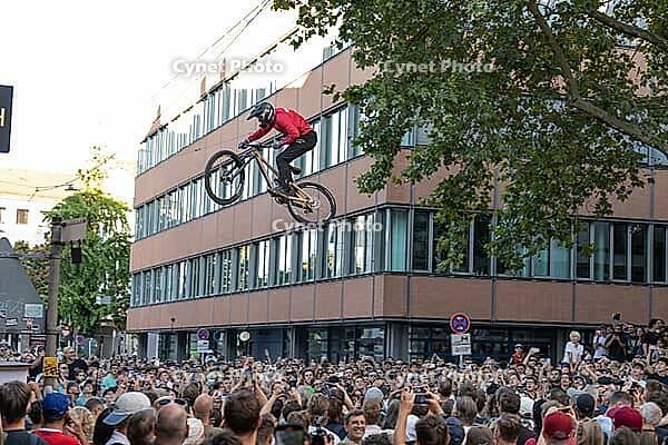 05 September 2026, Mountain bike riders jump over a crowd during the Red Bull Cerro Abajo urban downhill event in Stuttgart, Germany [IBR113394905]