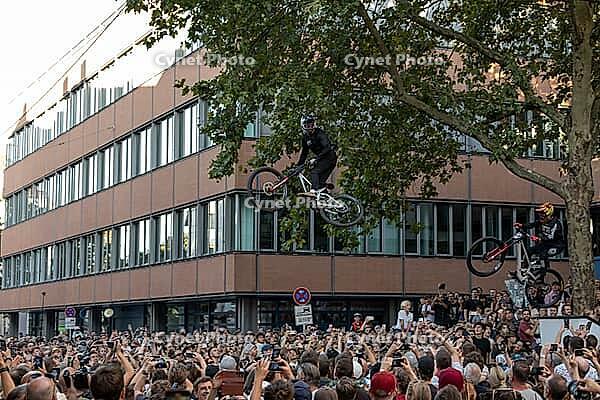 05 September 2026, a mountain bike rider jumps high above spectators at the Red Bull Cerro Abajo urban downhill race in Stuttgart, Germany [IBR113394906]