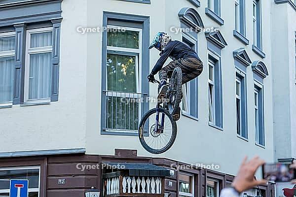 05 September 2026, a mountain biker leaps through the air during the Red Bull Stuttgart Cerro Abajo urban downhill race in Stuttgart, Germany [IBR113394908]