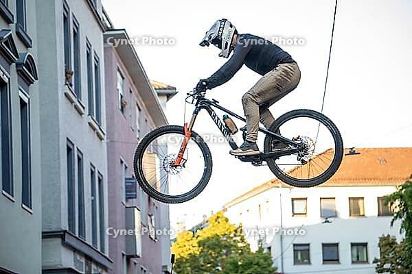 05 September 2026, a mountain biker leaps through the air during the Red Bull Stuttgart Cerro Abajo urban downhill race in Stuttgart, Germany [IBR113394910]