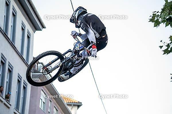 05 September 2026, a mountain biker leaps through the air during the Red Bull Stuttgart Cerro Abajo urban downhill race in Stuttgart, Germany [IBR113394913]