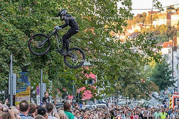 05 September 2026, A rider jumps mid-air during the Red Bull Cerro Abajo urban downhill mountain bike race in Stuttgart, Germany [IBR113394916]