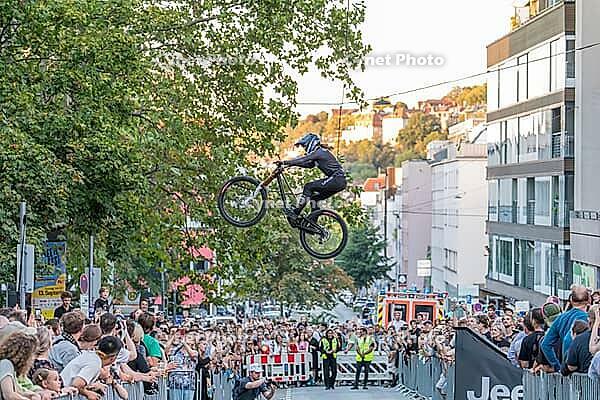 05 September 2026, A rider jumps mid-air during the Red Bull Cerro Abajo urban downhill mountain bike race in Stuttgart, Germany [IBR113394917]