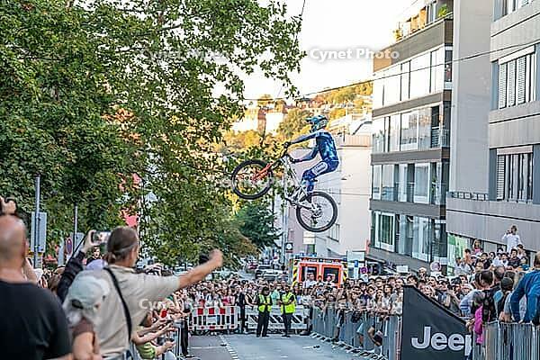 05 September 2026, A rider jumps mid-air during the Red Bull Cerro Abajo urban downhill mountain bike race in Stuttgart, Germany [IBR113394922]