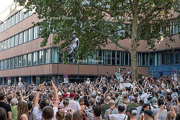 05 September 2026, Mountain bike riders jump over a crowd during the Red Bull Cerro Abajo urban downhill event in Stuttgart, Germany [IBR113394933]