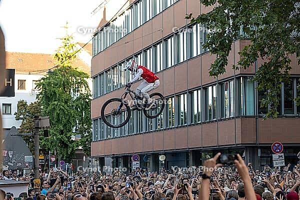 05 September 2026, Mountain bike riders jump over a crowd during the Red Bull Cerro Abajo urban downhill event in Stuttgart, Germany [IBR113394937]