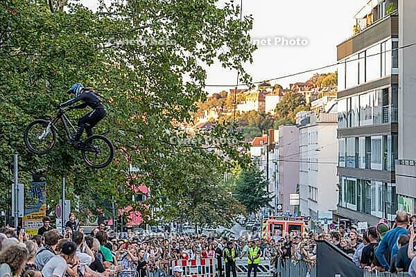 05 September 2026, A rider jumps mid-air during the Red Bull Cerro Abajo urban downhill mountain bike race in Stuttgart, Germany [IBR113394940]