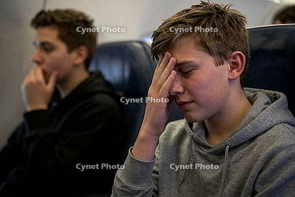 Adolescent passengers experience flight anxiety and motion sickness inside an airplane cabin during transit, travel fatigue and acute headache, youthful vulnerability during air travel, confined cabin space generating mental exhaustion and sensory oversti [IBR125414139]