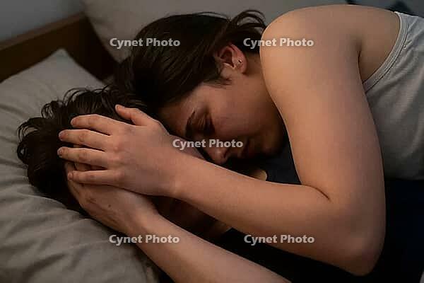Tender consolation and emotional support in bed, close embrace between vulnerable partners offers solace, quiet psychological healing through intimacy, protective posture providing safety against existential grief and acute mental distress, domestic sanct [IBR125414194]