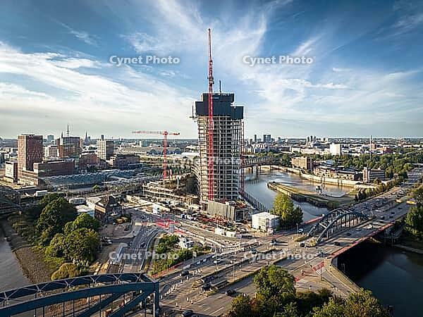 Aerial view of Elbtower construction site with construction cranes, Elbe bridges and intersection at Elbe bridges in front of Hamburg city skyline, Hamburg, Germany [IBR113394942]