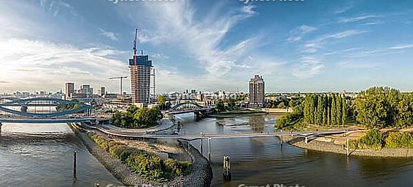 Panoramic view of the Entenwerder Bridge across the Norderelbe with Elbe bridges and Elbe Tower construction site in front of Hamburg city skyline, Hamburg, Germany [IBR113394943]