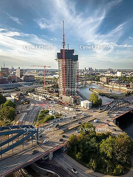 Aerial view of Elbtower construction site with construction cranes, Elbe bridges and intersection at Elbe bridges in front of Hamburg city skyline, Hamburg, Germany [IBR113394944]