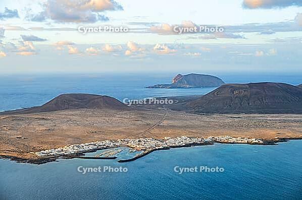 View of the sea and the island of La Graciosa with the village of Caleta de Sebo, at sunset, Lanzarote, Canary Islands, Spain [IBR125414220]