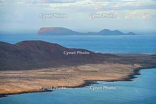 View of sea and the island of La Graciosa and the island of La Alegran, at sunset, Lanzarote, Canary Islands, Spain [IBR125414229]