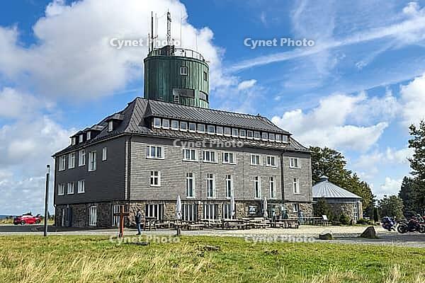 View of the Astenturm complex on the Kahler Asten, situated 841 metres above sea level, featuring a 21-metre-high observation tower, the official weather station of the German Weather Service (DWD) and the main building, comprising a hotel, restaurant and [IBR125414238]