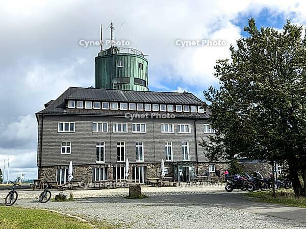 View of the Astenturm complex on the Kahler Asten, situated 841 metres above sea level, featuring a 21-metre-high observation tower, the official weather station of the German Weather Service (DWD) and the main building, comprising a hotel, restaurant and [IBR125414283]