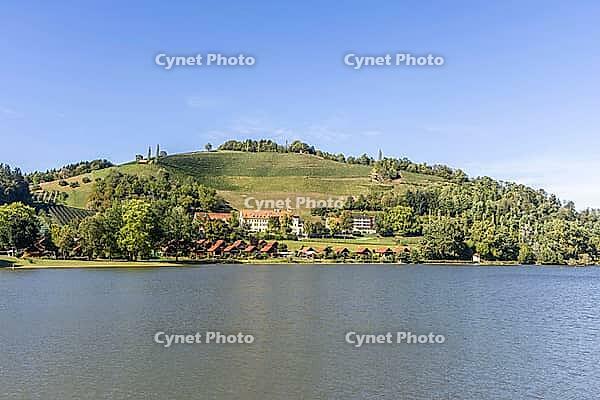 View over Lake Sulmsee to the Silberberg wine region, Sulmsee, Styria, Austria [IBR125415378]