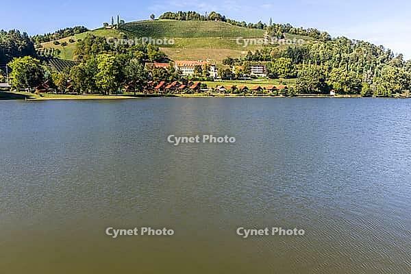 View over Lake Sulmsee to the Silberberg wine region, Sulmsee, Styria, Austria [IBR125415390]