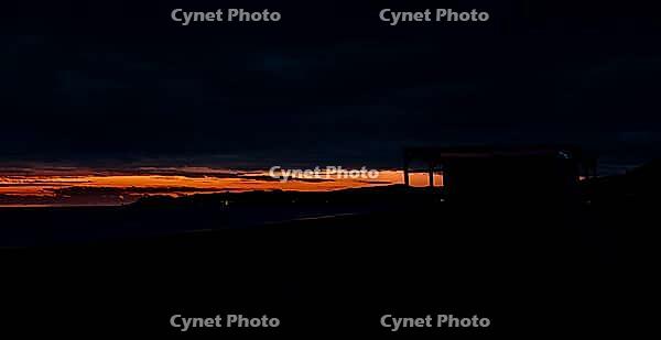 A photo of the sunset on the beautiful beach of Posada, Sardinia [IBR125415414]