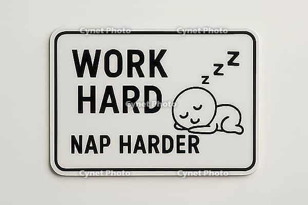 White sign with black text Work Hard Nap Harder and a sleeping cartoon character, emphasizing the importance of rest for productivity, AI generated [IBR125421189]