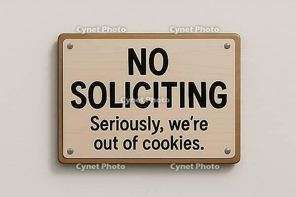 Wooden no soliciting sign on a white wall with the funny message seriously, we're out of cookies, AI generated [IBR125421218]
