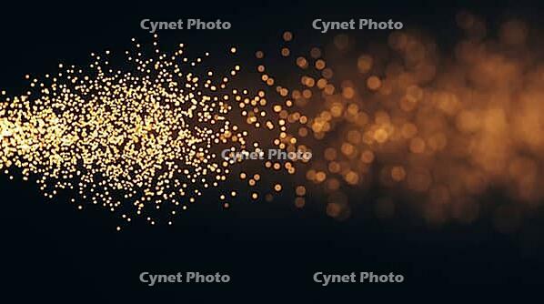 Abstract glowing amber particles densely clustered transitioning to diffuse soft light, representing diffusion controlled reaction, dark background, polymer science concept, AI generated [IBR125421266]