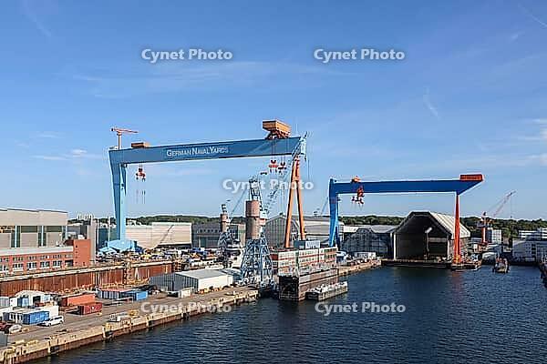 Kiel, Germany - 12. August 2026: German Naval Yards shipyard features cranes and docks for constructing ships [IBR125424511]