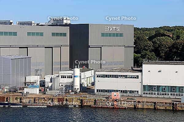 Kiel, Germany - 12. August 2026: ThyssenKrupp Marine Systems industrial buildings and dock by the water [IBR125424552]
