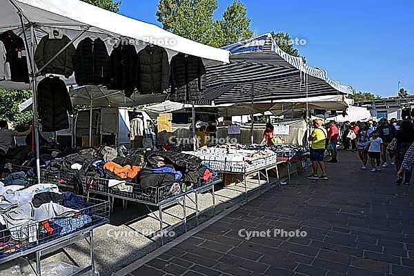 Lively market activity at an Italian weekly market market [IBR125436236]