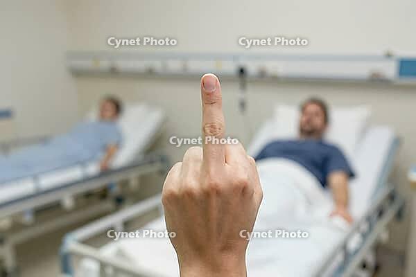 Middle finger gesture in a clinical hospital room confronting systemic healthcare failure, overworked nursing staff and neglected recovery patients, medical staff burnout during severe understaffing crisis, profound indignation toward administrative auste [IBR125446477]