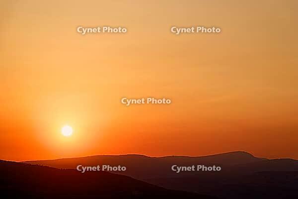 The sun is approaching the horizon and bathing the mountains in orange light, sunset, Maestrazgo (Maestrat, Alto Maestrazgo, l'Alt Maestrat), Spain's Most Beautiful Villages, The Most Beautiful Villages in Spain, the Middle Ages, mountain village, Culla,  [IBR125462134]