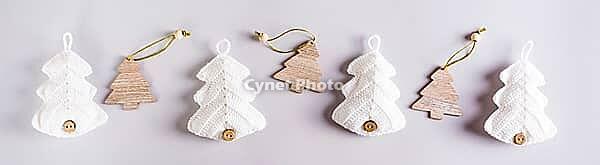 Knitted and wooden fir trees in a row on a gray background. Web banner [IBR125492323]