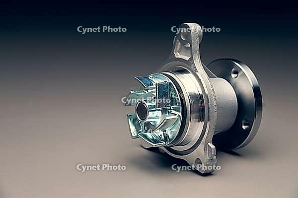 Engine cooling pump, engine coolant pump for a car on a black gradient background. Selective focus [IBR125492356]