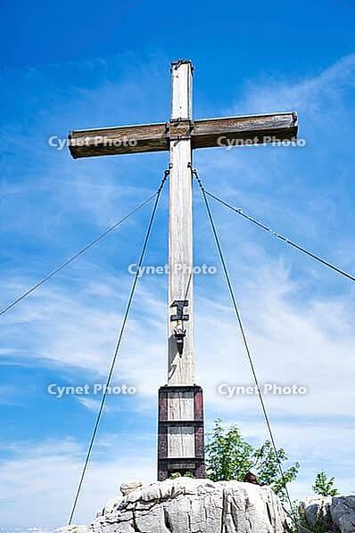 Wooden cross on the summit near Kampenwand, a famous mountain near Lake Chiemsee in Germany [IBR125492387]