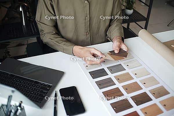 Architecture and Interior Designer man choosing interior materials [IBR125492390]