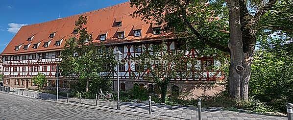Historic wine bar, originally a special infirmary for lepers, built 1446 to 1448, wine warehouse from 1571, one of the largest medieval half-timbered buildings in Germany, Maxplatz, Nuremberg, Middle Franconia, Bavaria, Germany [IBR125501611]