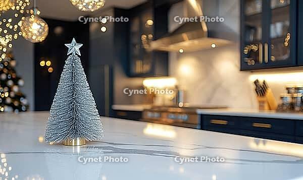 Elegant modern kitchen with white marble countertops, single silver Christmas tree figurine, AI generated [IBR125502144]