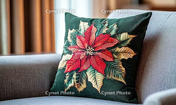 Dark green pillow with vibrant red poinsettia print and delicate gold accents, AI generated [IBR125502168]