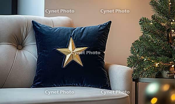 Dark blue velvet pillow with a single golden star embroidery, placed on a light gray couch, AI generated [IBR125502203]