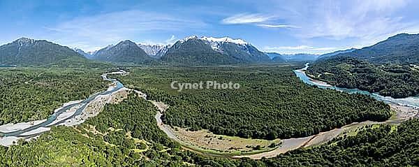 Aerial view, Rio Yelcho river at the end of Lago Yelcho, picturesque mountains with snow-capped peaks, Puerto Cardénas, Carretera Austral, Patagonia, Los Lagos, Chile [IBR125521095]