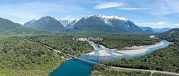 Bridge, river Rio Frio and Rio Yelcho at the end of Lago Yelcho, picturesque mountains with snow-capped peaks, Puerto Cardénas, Carretera Austral, Patagonia, Los Lagos, Chile [IBR125521105]