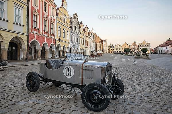 03 October 2026, A vintage Praga race car is parked on the historic cobblestone main square at sunset in Telč, Czech Republic [IBR125527034]
