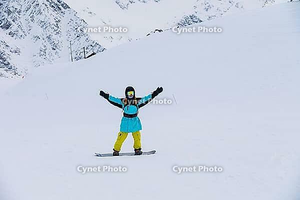 Handsome man smiling at ski resort, rider portrait. Happy tourist on vacation [IBR125527082]