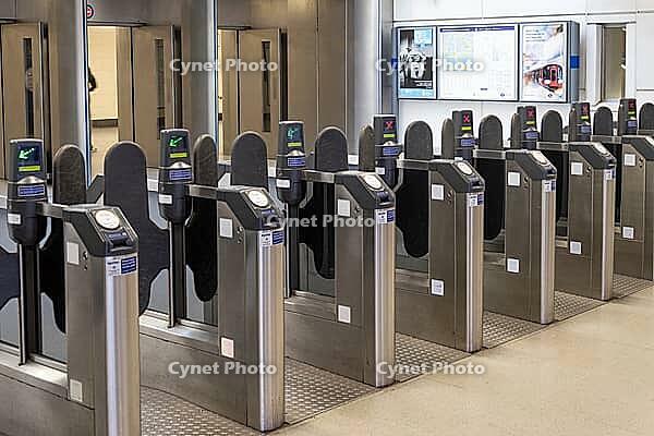 Row of automated ticket barriers and electronic turnstiles at a public subway station entrance with contactless card readers. London, UK, 11 February 2024 [IBR125527084]