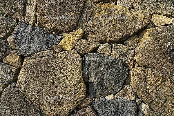 Himeji, Japan - Sep 24 2024, Close-up view of the cobblestone fortress wall, consisting of large stones, without people, in the daytime, Himeji, Japan [IBR125527107]