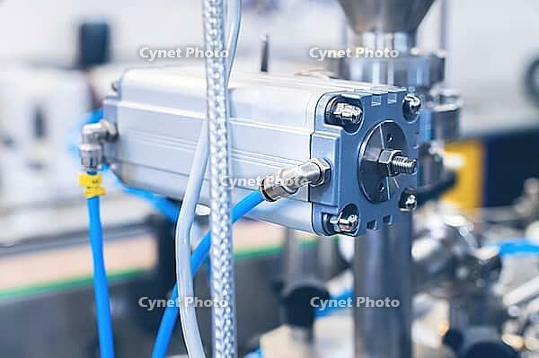 Many pneumatic hose fittings that connect to air or water hoses are installed on pneumatic equipment on a production line [IBR125536404]